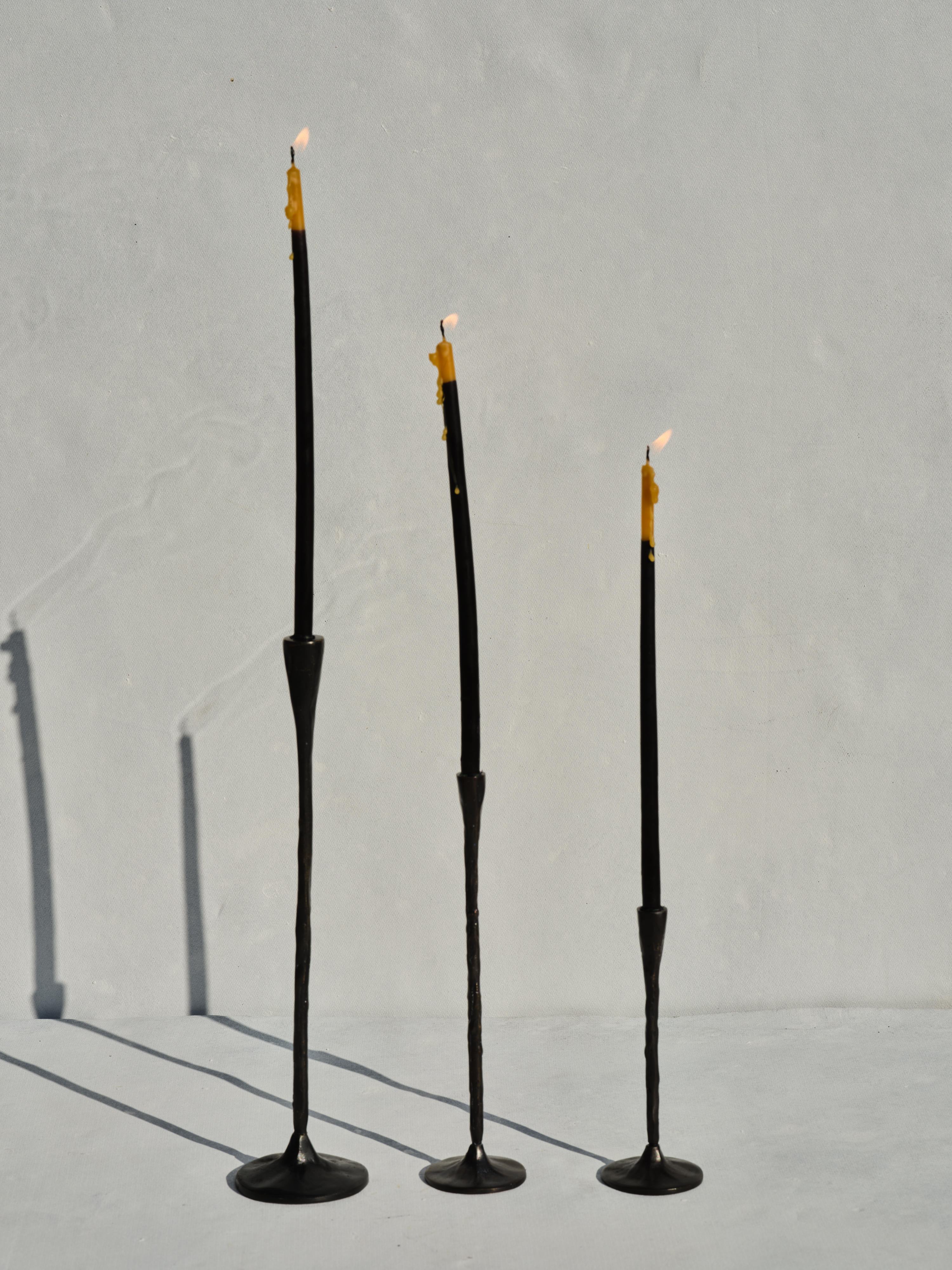 3 GRACES - Black brass candlestick holders in different heights